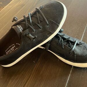 Black Sperry tennis shoes
